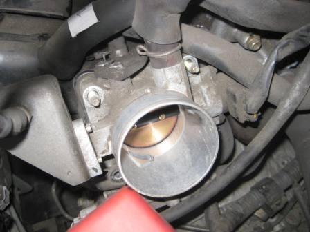 Input side of throttle body after removing the rubber hose (snorkel) from air box. Very clean.