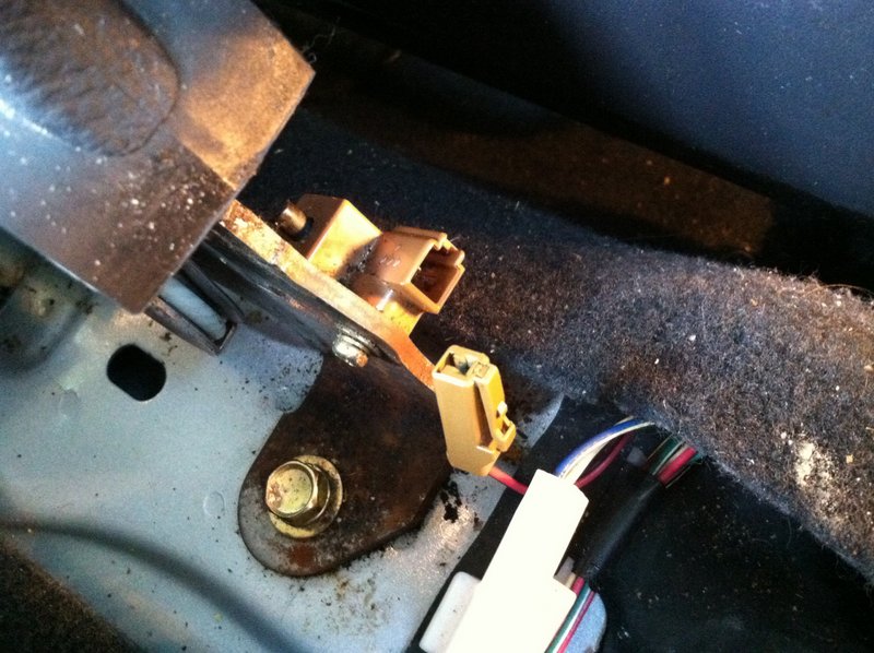 The parking brake switch up close with the connector detached.