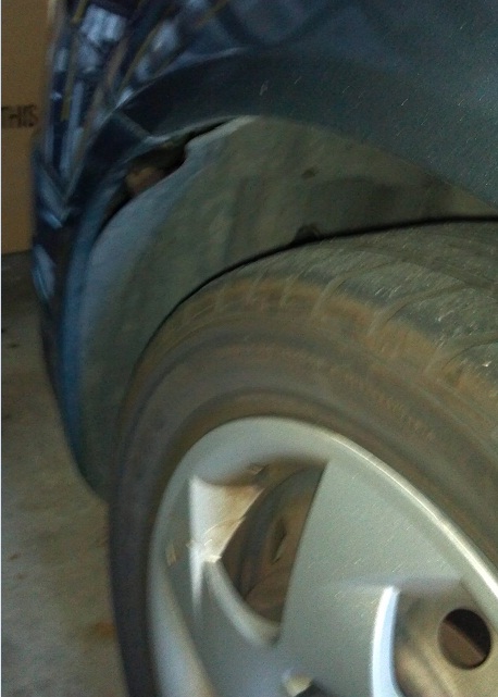 Is this called a wheel well?  See how it's coming away from the panel?