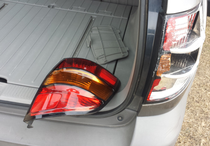The "new" tail light lens from off of eBay, at about 1/2 cost of 'real' New. ;) It was in replacing this that I could see the car has only been waxed once, if ever, in it's entire life. Also, these are good leaf/dirt catchers; might be a good idea to pull and clean behind them annually or bi-annually, if you plan to keep your Vibe corrosion free for a long, long time.