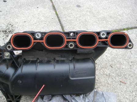 New intake manifold gasket (Toyota Part #17171-22060). Notice how it is the burnt orange color.
